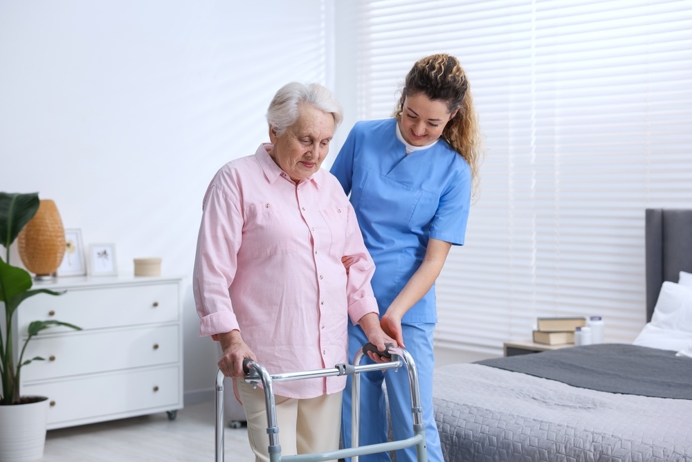 Nurse tending to elderly client in respite care